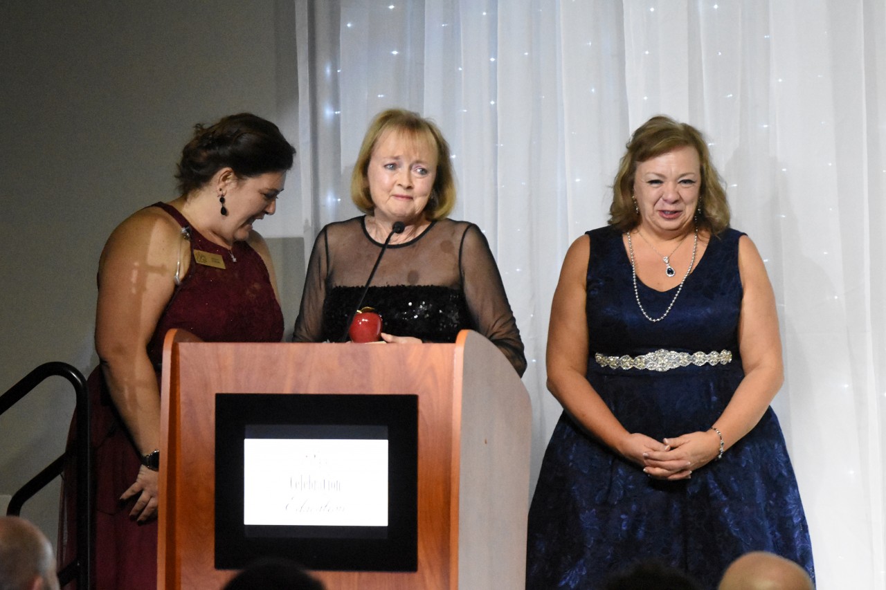 Rebecca Johnston receiving the Alumna of the Year Award