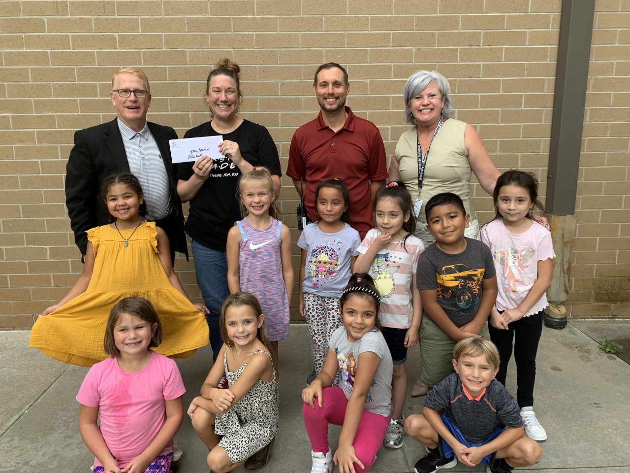 Jenny Kramer pictured with Lisa Marie and students celebrating CCEF winnings.