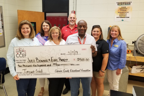 CCEF Board Members presenting a $2,500 check for an Impact Grant.